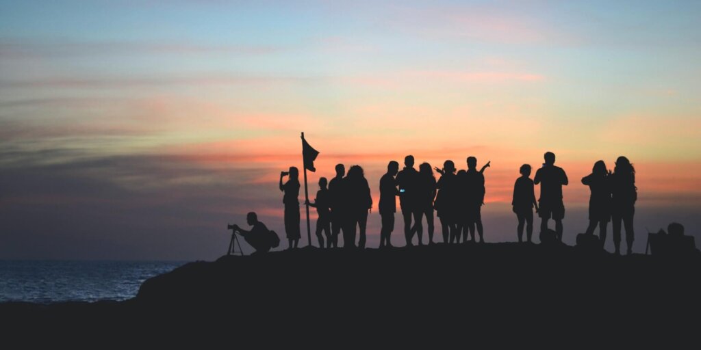 silhouettes of people and the sunset